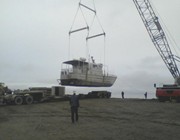 Getting craned off the truck at F Pad — in Prudhoe Bay, AK.